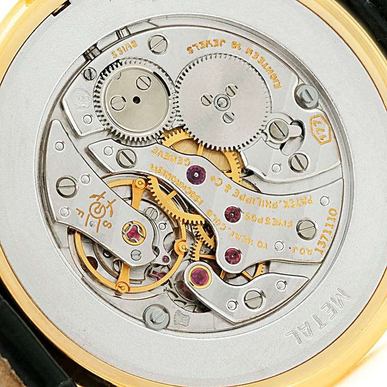 This image shows the intricate mechanical movement and components of the Patek Philippe Calatrava 3520 Men's Yellow Gold White Dial 3520 Men's Yellow Gold White Dial model from the back.