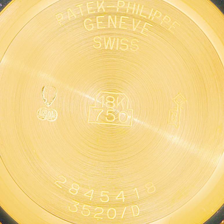 The image shows the back case of a Patek Philippe Calatrava 3520 Men's Yellow Gold White Dial 3520 Men's Yellow Gold White Dial watch, focusing on the engraved details and hallmarks indicating 18K gold.