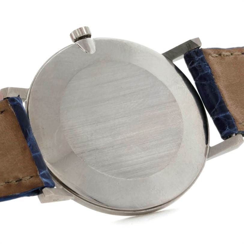 This image shows the back view of a Vintage Patek Philippe watch with its crown and leather straps visible.