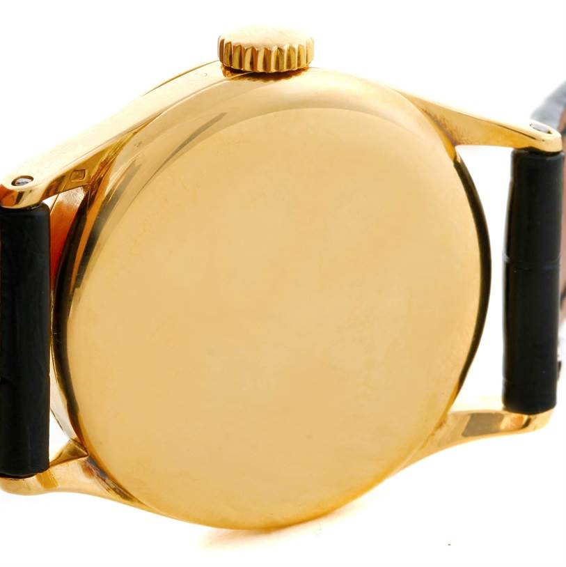 This image shows the back and side of the case, crown, and part of the strap of a Vintage Patek Philippe watch.