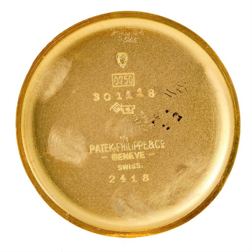 This image shows the inner case back of a vintage Patek Philippe watch model 2418.