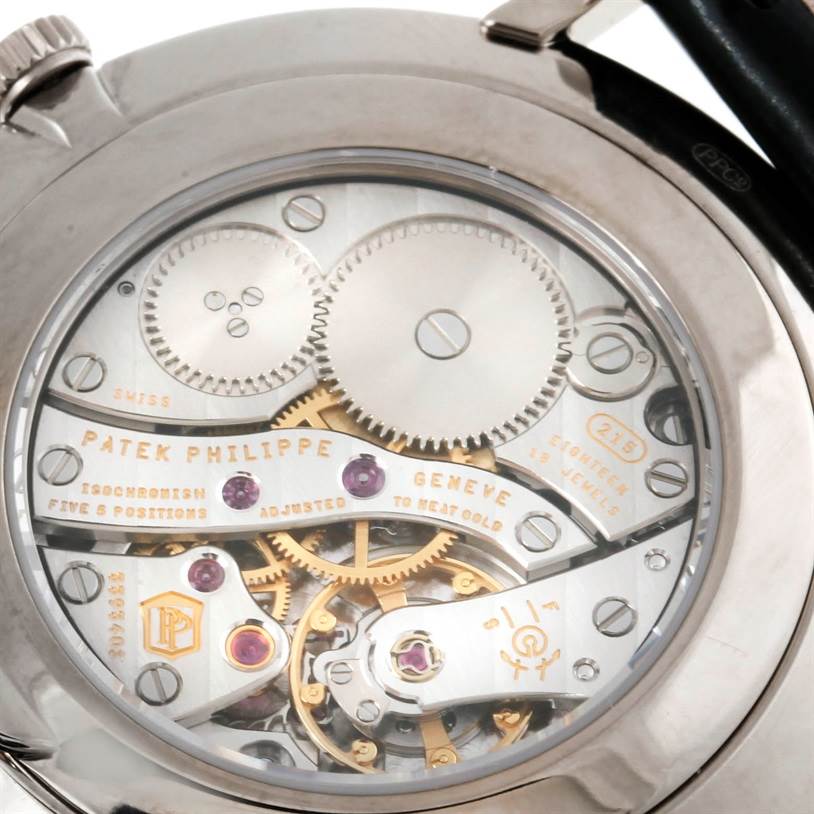 The image shows the back view of a Patek Philippe Calatrava 5119G Men's White Gold White Dial 5119G Men's White Gold White Dial watch, highlighting its visible inner mechanical components.