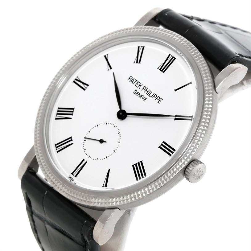 The image shows a Patek Philippe Calatrava 5119G Men's White Gold White Dial 5119G Men's White Gold White Dial watch at an angle highlighting the face, bezel, strap, and crown.