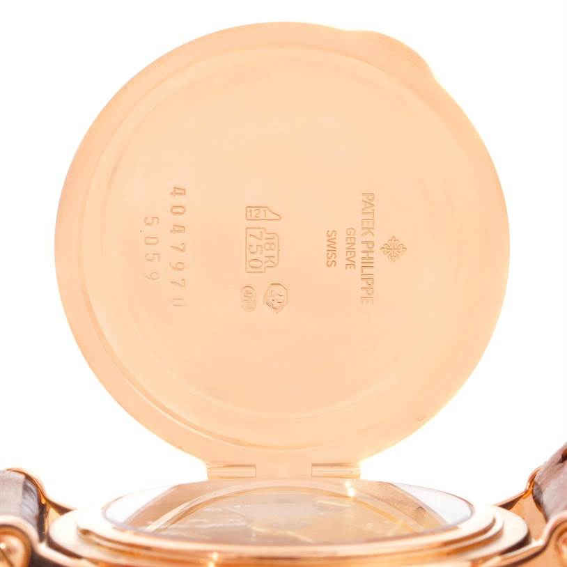 The image shows the open case back of the Patek Philippe 5059R Men
s Rose Gold White Dial 5059R Men
s Rose Gold White Dial 5059R Perpetual Calendar Retrograde 18k Rose Gold Watch, revealing inner markings.