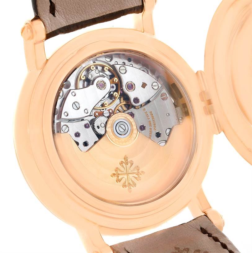 This image shows the open case back view of the Patek Philippe 5059R Men
s Rose Gold White Dial 5059R Men
s Rose Gold White Dial Perpetual Calendar Retrograde 18k Rose Gold Watch 5059R, revealing its inner mechanics.
