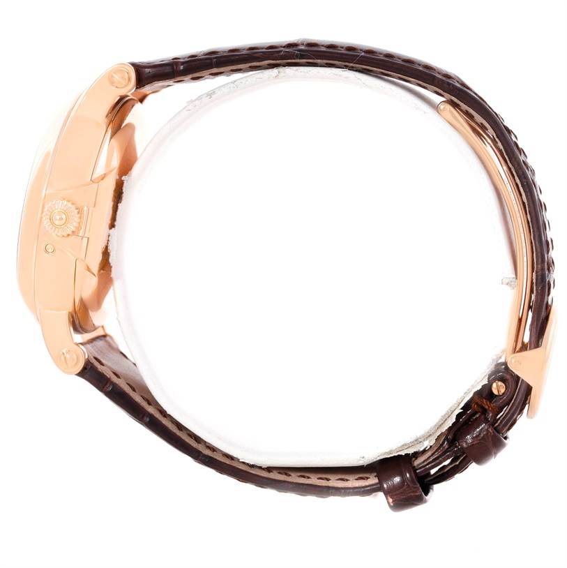 The image shows the Patek Philippe 5059R Men
s Rose Gold White Dial 5059R Men
s Rose Gold White Dial Perpetual Calendar Retrograde 5059R watch from a side profile, highlighting the crown and leather strap.