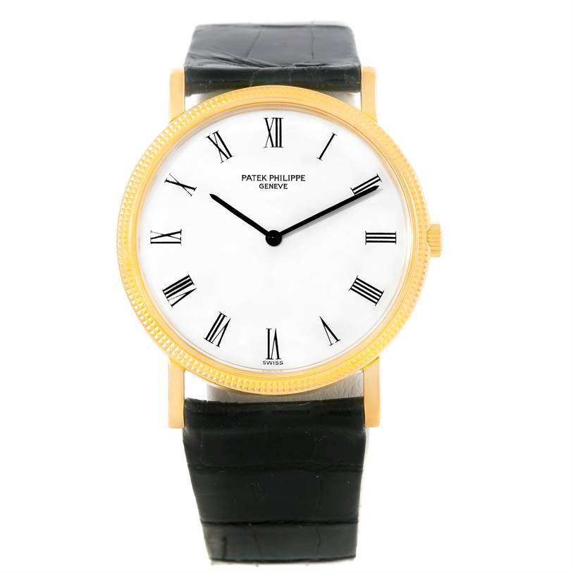 The image shows a front view of a Patek Philippe Calatrava 3520 Men's Yellow Gold White Dial 3520 Men's Yellow Gold White Dial watch with a gold case, white dial, Roman numerals, and a black leather strap.