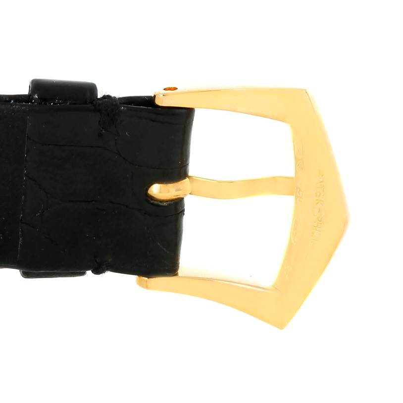 This image shows a side angle of the clasp and strap of a Patek Philippe Calatrava 3520 Men's Yellow Gold White Dial 3520 Men's Yellow Gold White Dial watch.