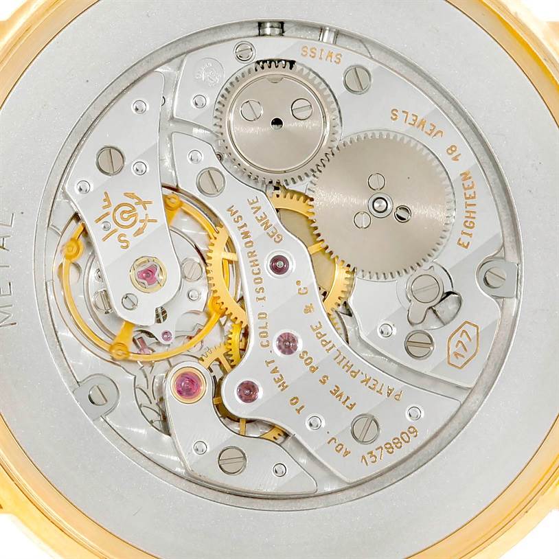 This image shows the back view of a Patek Philippe Calatrava 3520 Men's Yellow Gold White Dial 3520 Men's Yellow Gold White Dial, revealing its intricate mechanical movement.