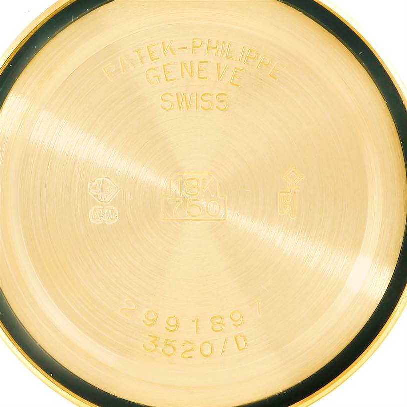 The image shows the inside case back of a Patek Philippe Calatrava 3520 Men's Yellow Gold White Dial 3520 Men's Yellow Gold White Dial watch, featuring inscriptions and hallmarks.