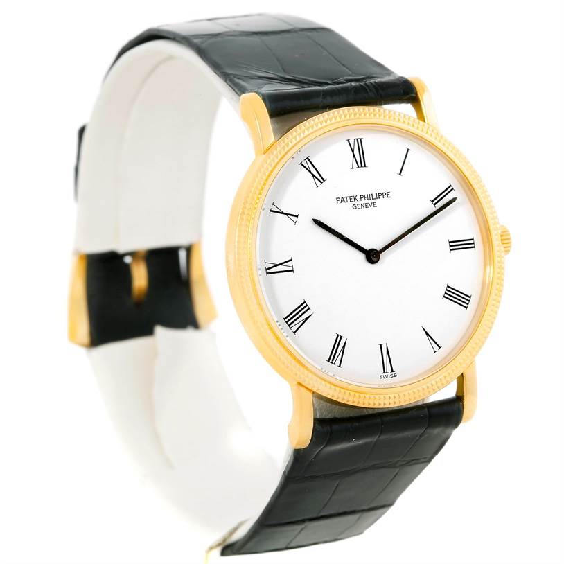The image shows a Patek Philippe Calatrava 3520 Men's Yellow Gold White Dial 3520 Men's Yellow Gold White Dial watch at a 3/4 angle, highlighting the watch face, gold case, and black leather strap.
