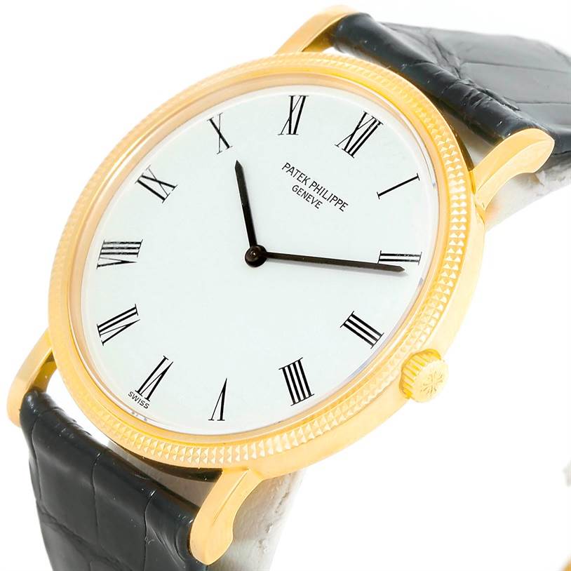The image shows a close-up angled view of a Patek Philippe Calatrava 3520 Men's Yellow Gold White Dial 3520 Men's Yellow Gold White Dial watch displaying the face, case, and partial strap.