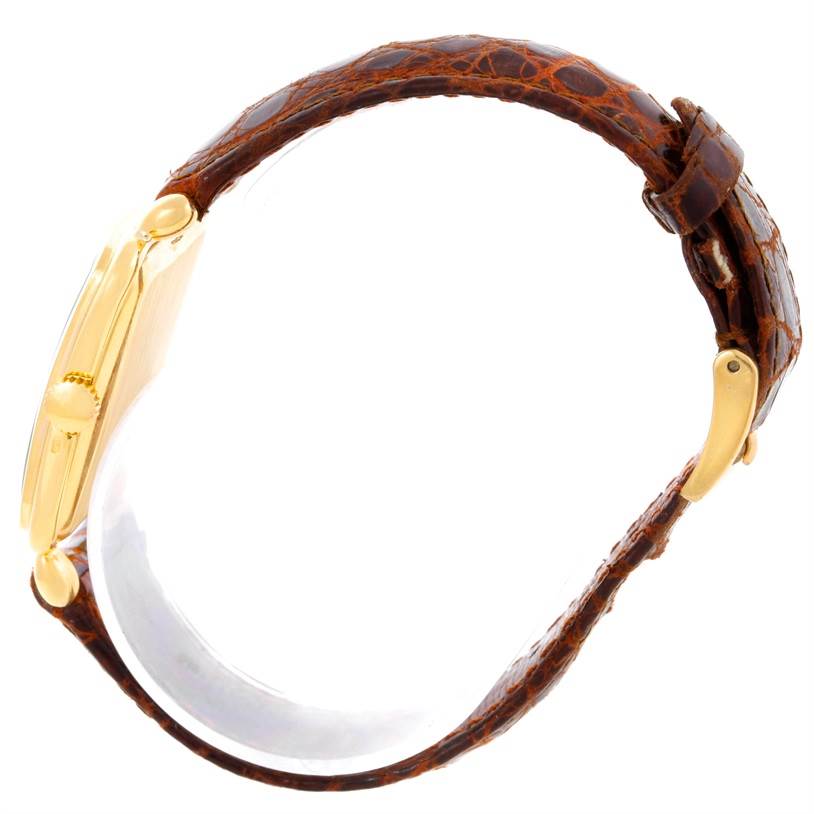 This side view of the Patek Philippe Vintage 2493 Men's Yellow Gold Silver Dial 2493 Men's Yellow Gold Silver Dial model showcases the watch case and brown leather strap.