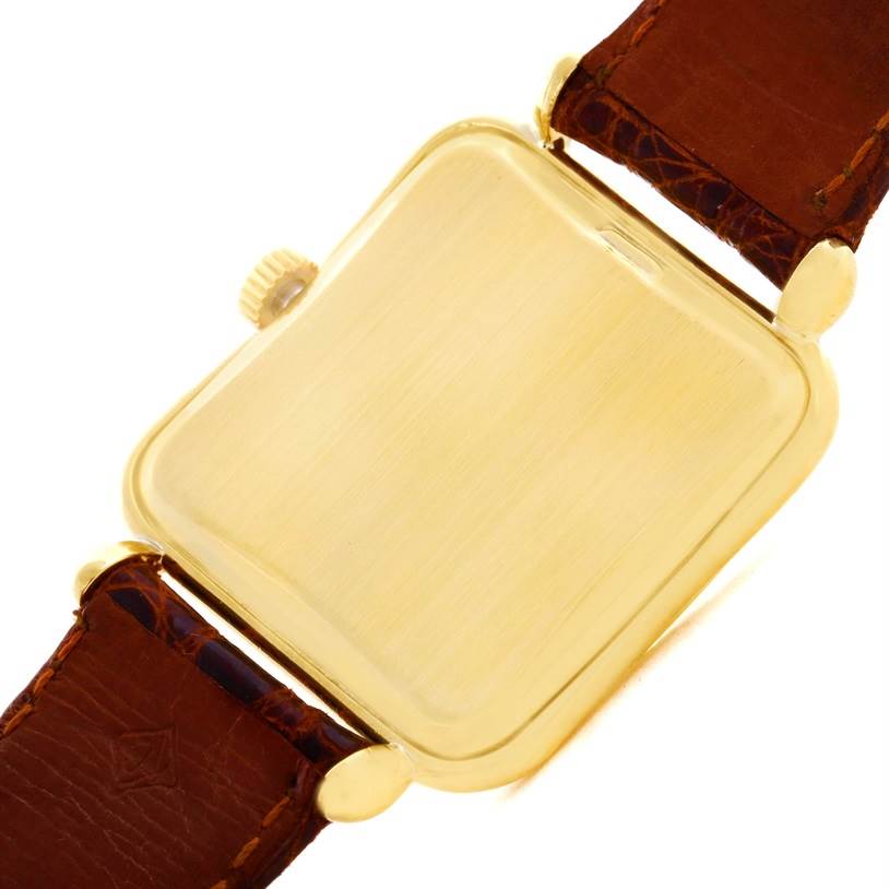 This image shows the back and partial side view of a Vintage Patek Philippe watch with a leather strap.