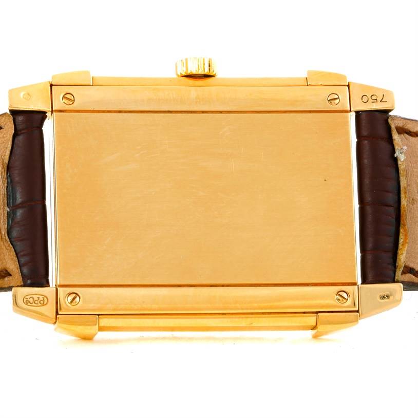 The image shows the back view of a Patek Philippe Gondolo 5111J Men's Yellow Gold Silver Dial 5111J Men's Yellow Gold Silver Dial watch, highlighting the gold case and leather straps.