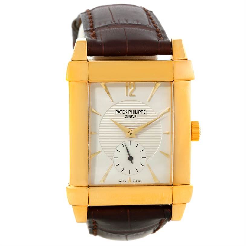 This image shows a front view of the Patek Philippe Gondolo 5111J Men's Yellow Gold Silver Dial 5111J Men's Yellow Gold Silver Dial watch, highlighting its golden rectangular case, dial, and brown leather strap.