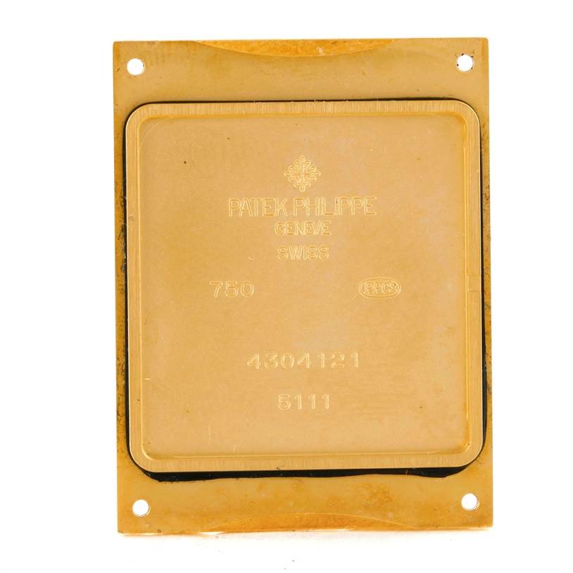 This image shows the case back of a Patek Philippe Gondolo 5111J Men's Yellow Gold Silver Dial 5111J Men's Yellow Gold Silver Dial watch, viewed from the back.