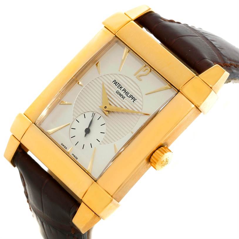 This image shows the face, case, crown, and part of the strap of the Patek Philippe Gondolo 5111J Men's Yellow Gold Silver Dial 5111J Men's Yellow Gold Silver Dial watch, angled slightly to the side.