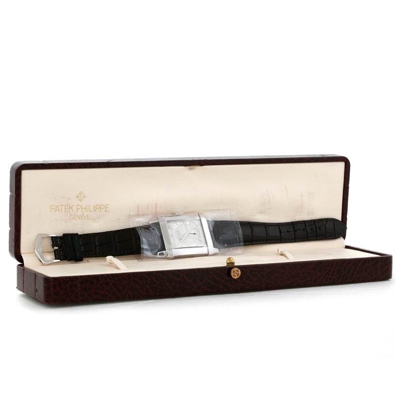 The Patek Philippe Gondolo 5111G Men's White Gold Silver Dial 5111G Men's White Gold Silver Dial watch is displayed front-on in an open leather case, showing its face and black leather strap.