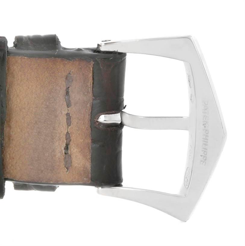 This image shows a close-up of the buckle and a portion of the leather strap of the Patek Philippe Gondolo 5111G Men's White Gold Silver Dial 5111G Men's White Gold Silver Dial watch.