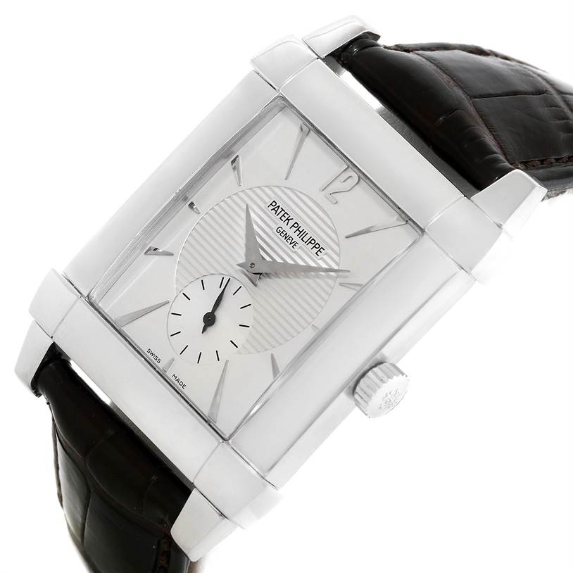 The image shows a Patek Philippe Gondolo 5111G Men's White Gold Silver Dial 5111G Men's White Gold Silver Dial watch at an angled side view, highlighting its rectangular face and leather strap.
