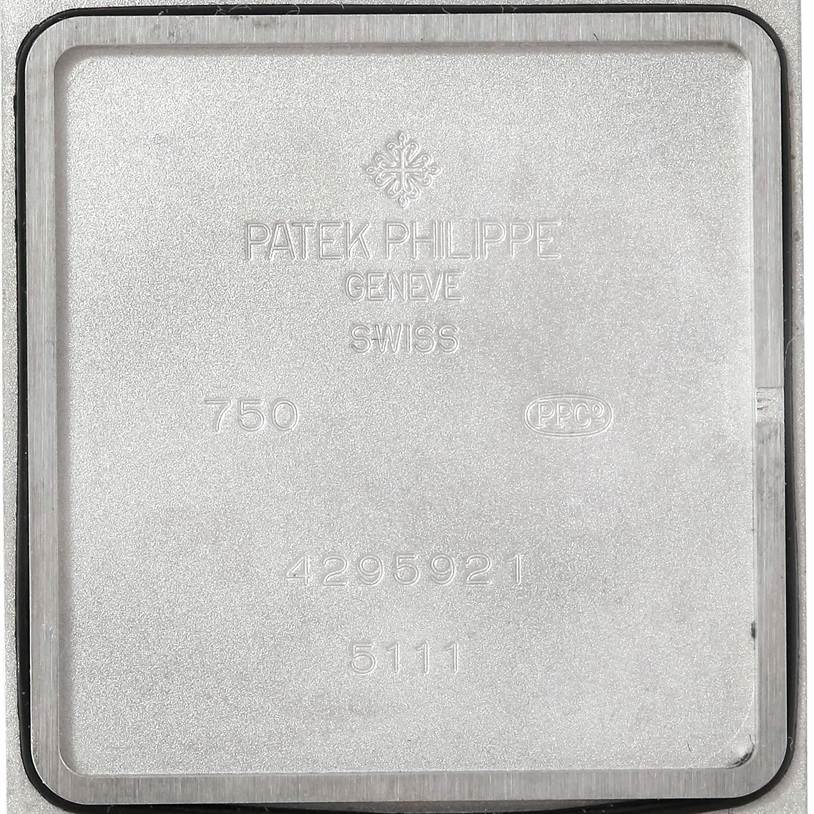 This is the interior case back of a Patek Philippe Gondolo 5111G Men's White Gold Silver Dial 5111G Men's White Gold Silver Dial watch, showing engraved details and serial numbers.