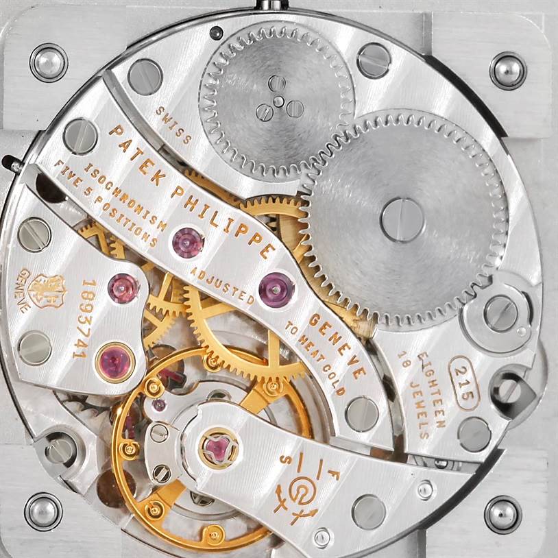 The image shows a detailed close-up of the movement and internal mechanics of a Patek Philippe Gondolo 5111G Men's White Gold Silver Dial 5111G Men's White Gold Silver Dial watch.