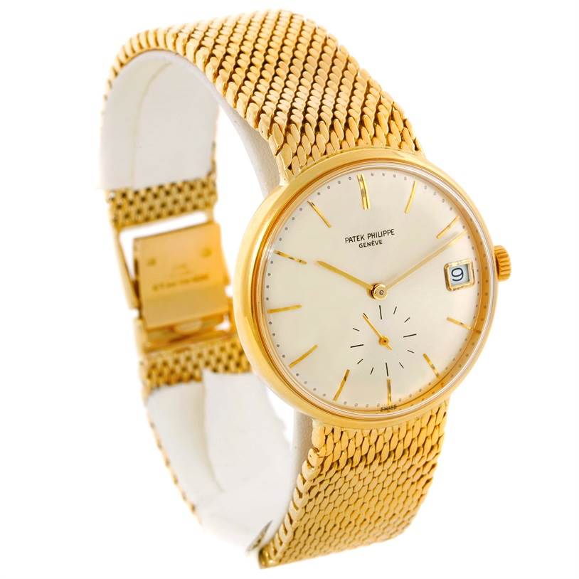 This image shows a Vintage Patek Philippe watch with a gold mesh bracelet, viewed from an angled front perspective.