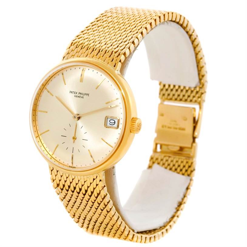 This image shows a front angle of the Vintage Patek Philippe watch, highlighting its gold mesh band and dial with a date window.