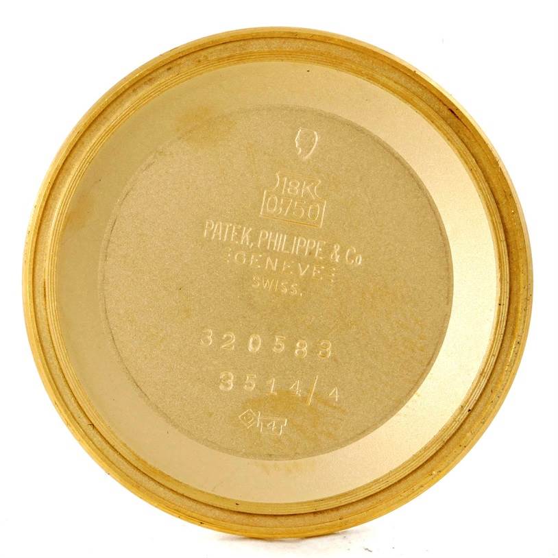 The image shows the inside back cover of a Vintage Patek Philippe watch, displaying engravings and serial numbers.