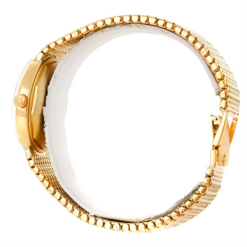 The image shows a side view of a gold Patek Philippe Vintage watch, highlighting the case, crown, and part of the bracelet and clasp.