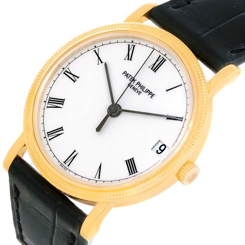 The image shows a front angle of a Patek Philippe Calatrava 3802 Men's Yellow Gold White Dial 3802 Men's Yellow Gold White Dial watch, highlighting its dial, bezel, crown, and leather strap.