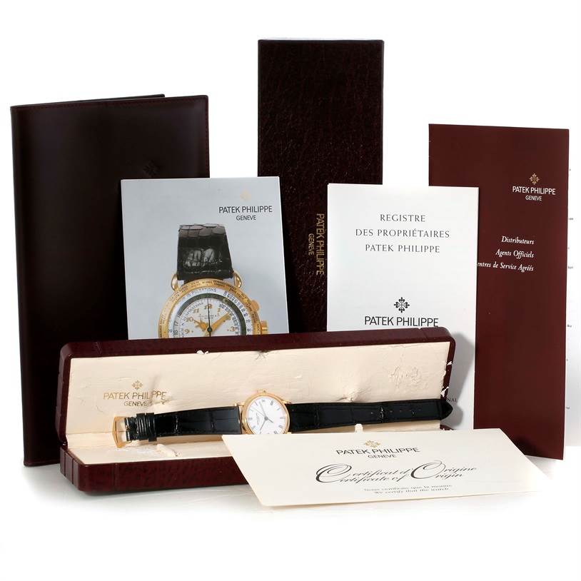 The image shows a Patek Philippe Calatrava 3802 Men's Yellow Gold White Dial 3802 Men's Yellow Gold White Dial watch in its box, accompanied by manuals and the certificate of origin.