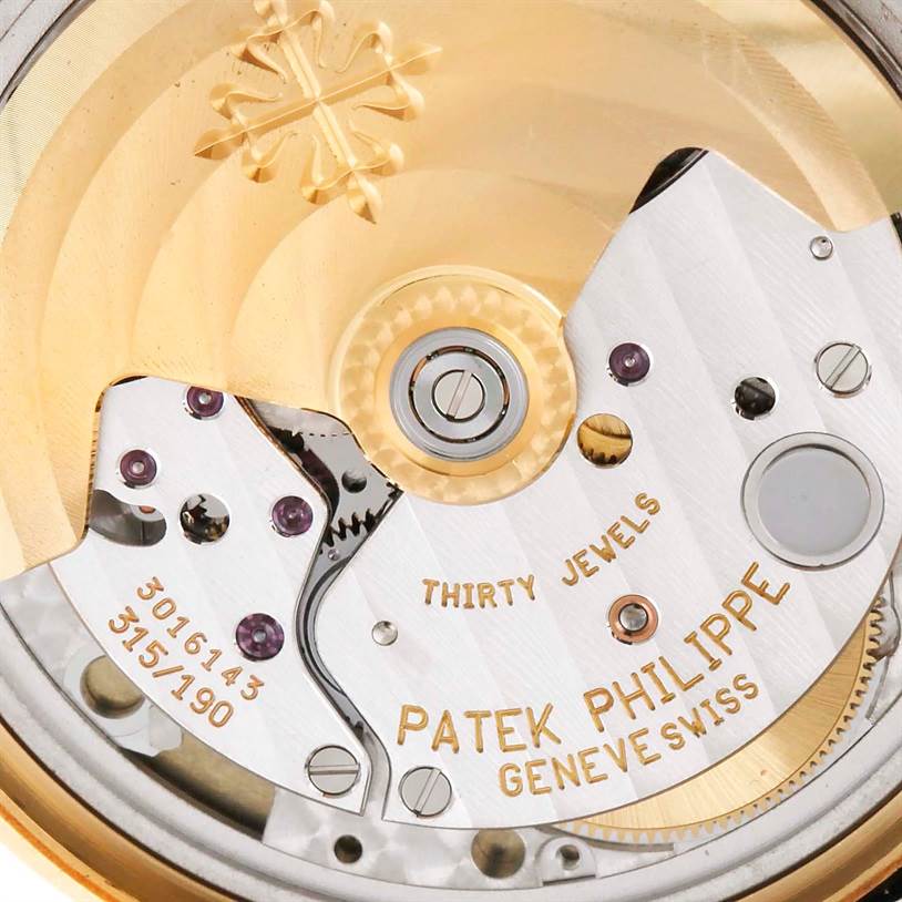 This image shows a close-up of the movement mechanism inside a Patek Philippe Calatrava 3802 Men's Yellow Gold White Dial 3802 Men's Yellow Gold White Dial watch.