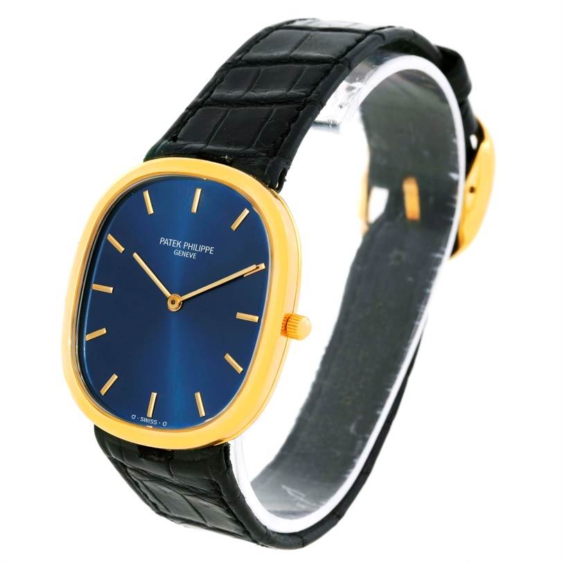 This image shows a side view of the Patek Philippe Golden Ellipse 3738 Men's Yellow Gold Blue Dial 3738 Men's Yellow Gold Blue Dial watch, highlighting its blue dial, gold case, and black strap.