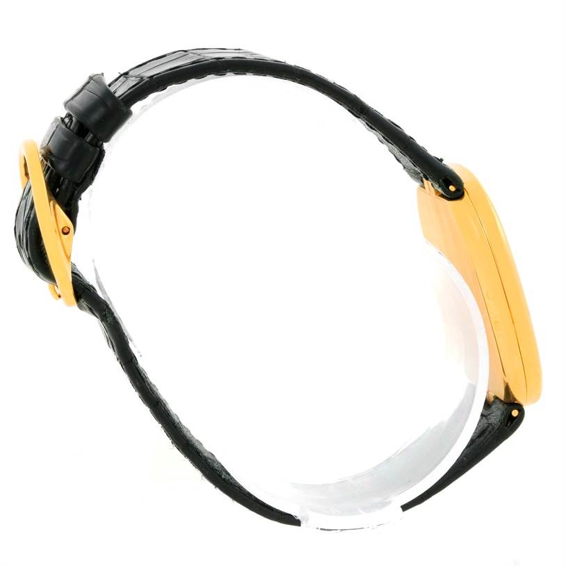 The image shows the side view of a Patek Philippe Golden Ellipse 3738 Men's Yellow Gold Blue Dial 3738 Men's Yellow Gold Blue Dial watch, highlighting the case and the strap.