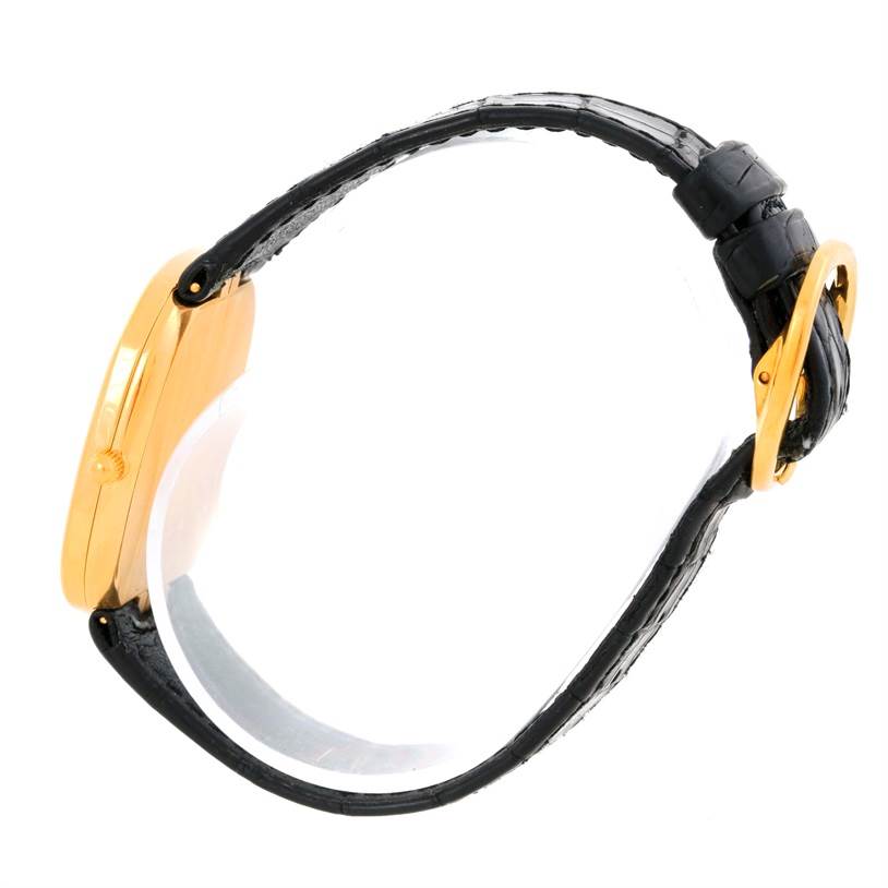 This image shows a side view of the Patek Philippe Golden Ellipse 3738 Men's Yellow Gold Blue Dial 3738 Men's Yellow Gold Blue Dial watch, highlighting its case, strap, and buckle.