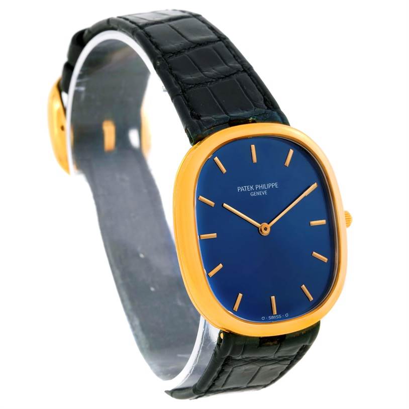 The image shows a frontal angle view of a Patek Philippe Golden Ellipse 3738 Men's Yellow Gold Blue Dial 3738 Men's Yellow Gold Blue Dial watch, highlighting the blue dial, gold case, and black strap.