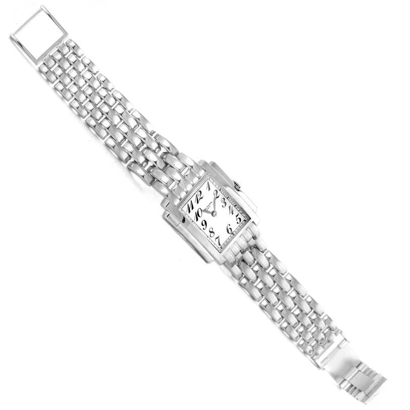 The image shows a top-down view of the Patek Philippe Gondolo 4824 Women's White Gold White Dial 4824 Women's White Gold White Dial watch, displaying its rectangular face and metal bracelet.