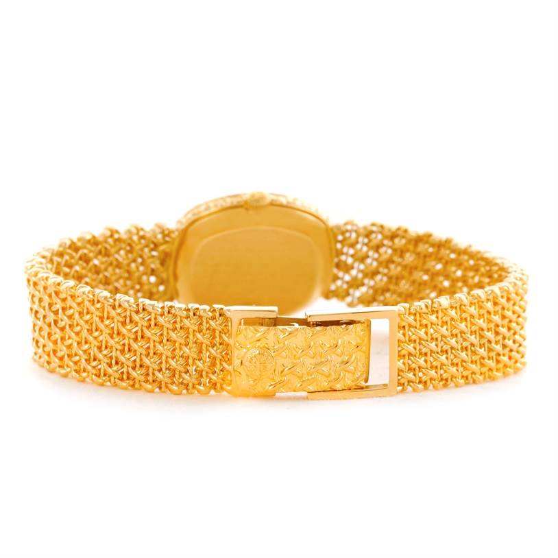 This image shows the back view of a Vintage Patek Philippe watch, focusing on the woven gold bracelet and clasp.