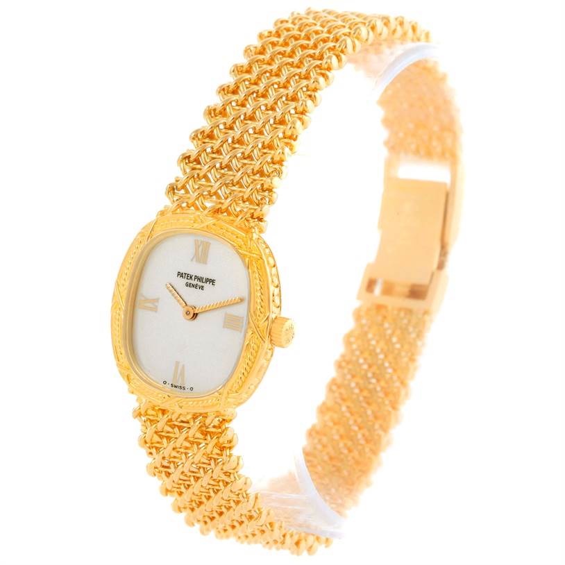 The image shows a side angle of the Patek Philippe Vintage 4523/1 Women's Yellow Gold Silver Dial 4523/1 Women's Yellow Gold Silver Dial watch, highlighting its gold mesh band, rectangular case, and dial.