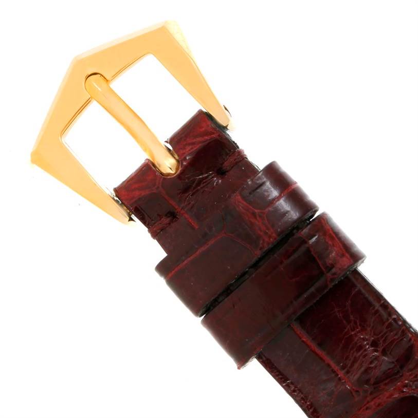 The image shows a close-up of the buckle and strap of a Patek Philippe Gondolo 4825/100 Women's Yellow Gold White Dial 4825/100 Women's Yellow Gold White Dial model watch.