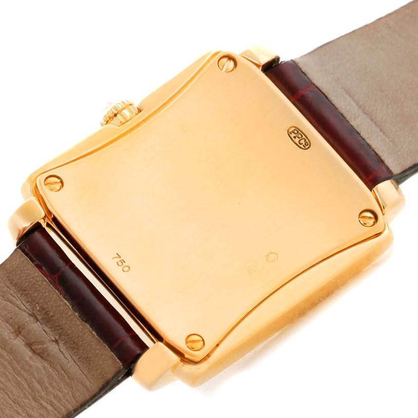 The image shows the back case and part of the strap of a Patek Philippe Gondolo 4825/100 Women's Yellow Gold White Dial 4825/100 Women's Yellow Gold White Dial watch from a rear angle.