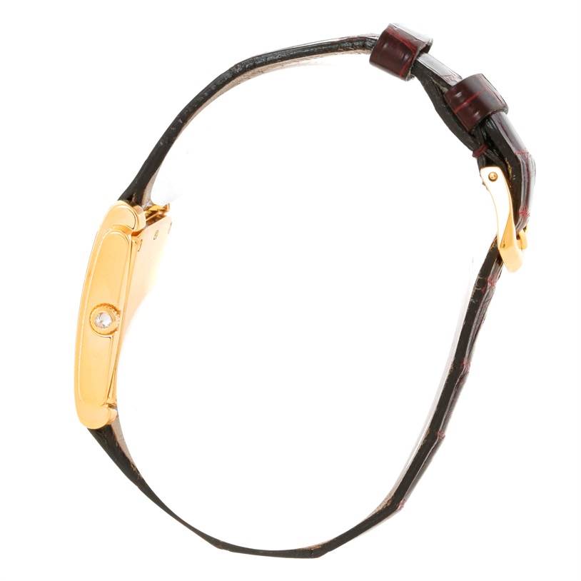 The image shows a side view of a Patek Philippe Gondolo 4825/100 Women's Yellow Gold White Dial 4825/100 Women's Yellow Gold White Dial model watch, featuring the case and buckle sections.