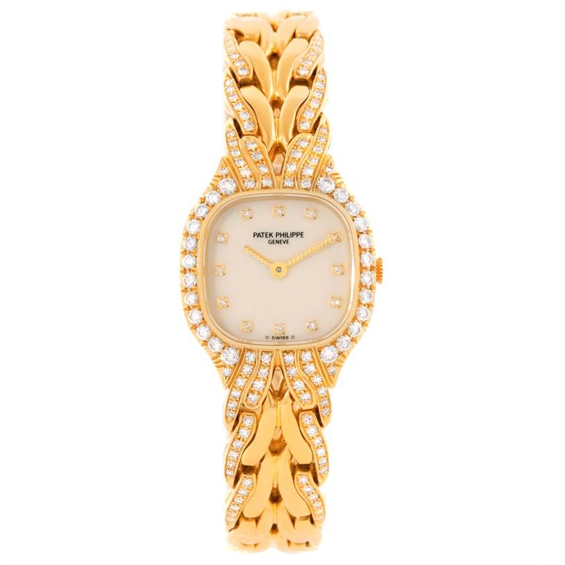 This image shows a Patek Philippe La Flamme  4815/3 Women's Yellow Gold Champagne Dial 4815/3 Women's Yellow Gold Champagne Dialwatch from a top-down view, highlighting its diamond-studded bezel and gold bracelet.