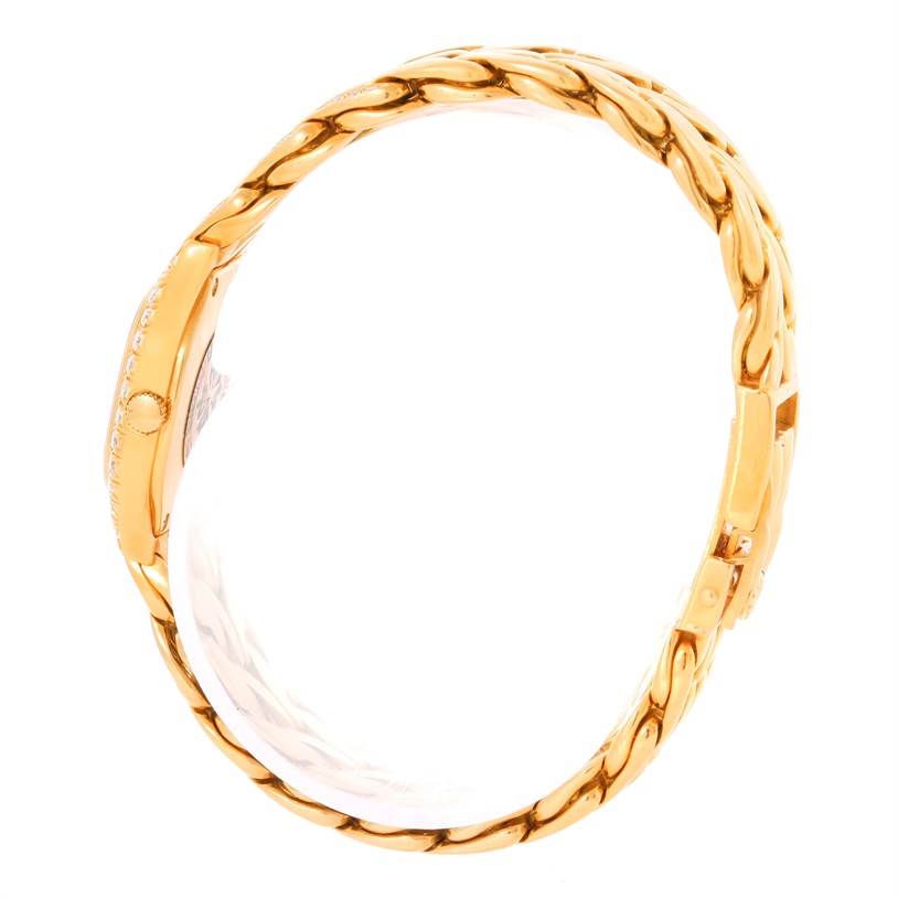 The image shows a side view of the La Flamme model watch by Patek Philippe, highlighting its gold bracelet and side profile.