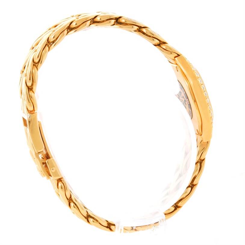 The image shows a side view of the Patek Philippe La Flamme  4815/3 Women's Yellow Gold Champagne Dial 4815/3 Women's Yellow Gold Champagne Dialmodel, highlighting its gold bracelet and clasp.