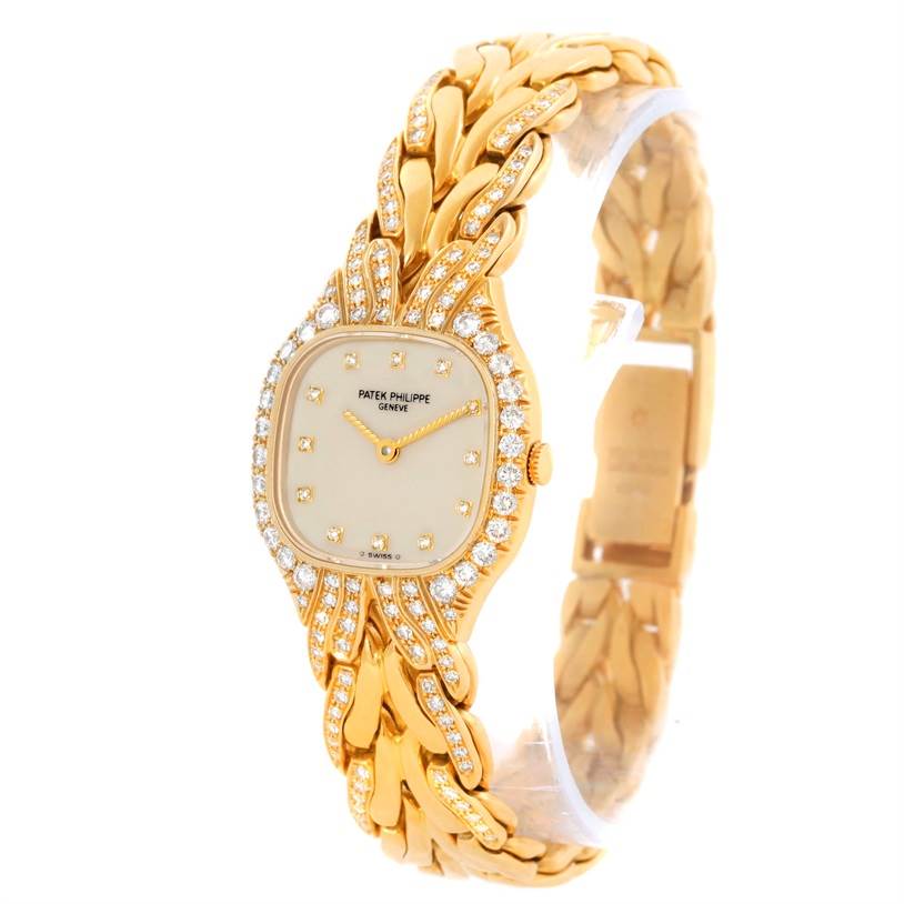 This image shows a La Flamme model by Patek Philippe from a front angle, highlighting its gold case, diamond bezel, and bracelet.