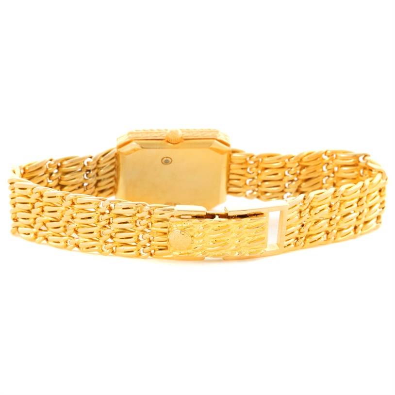 This image shows the back and clasp of the Patek Philippe 4667 Women's Yellow Gold Beige Dial 4667 Women's Yellow Gold Beige Dial 4667 18k Yellow Gold Diamond Emerald Ladies Watch.