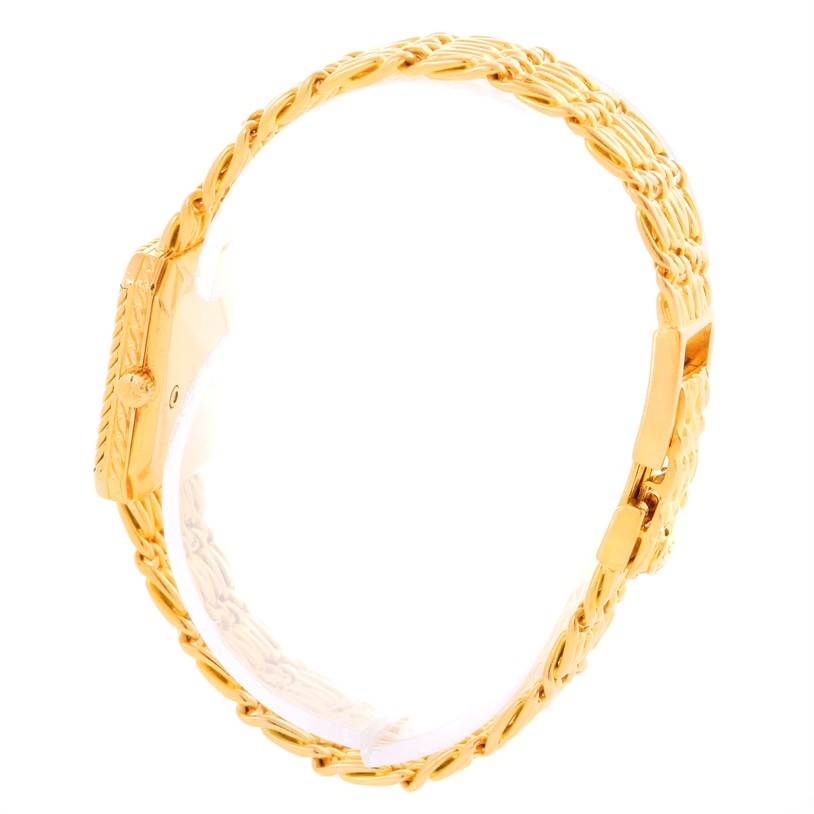 This image shows the side view of a Patek Philippe 4667 Women's Yellow Gold Beige Dial 4667 Women's Yellow Gold Beige Dial 4667 model 18k Yellow Gold Diamond Emerald Ladies Watch, highlighting its band and case.